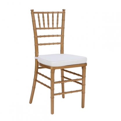Elegant Chiavari Chair rental in Sonoma, Ca at a vineyard wedding reception | Close-up of a white Chiavari chair with a decorative cushion | Guests seated comfortably on gold Chiavari chairs at an outdoor event